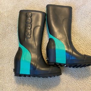 Sorel rain boots with 3-inch hidden wedge heel. Never worn/perfect condition